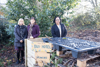 Employees from Highworth Grammar School stand with the new compost bin